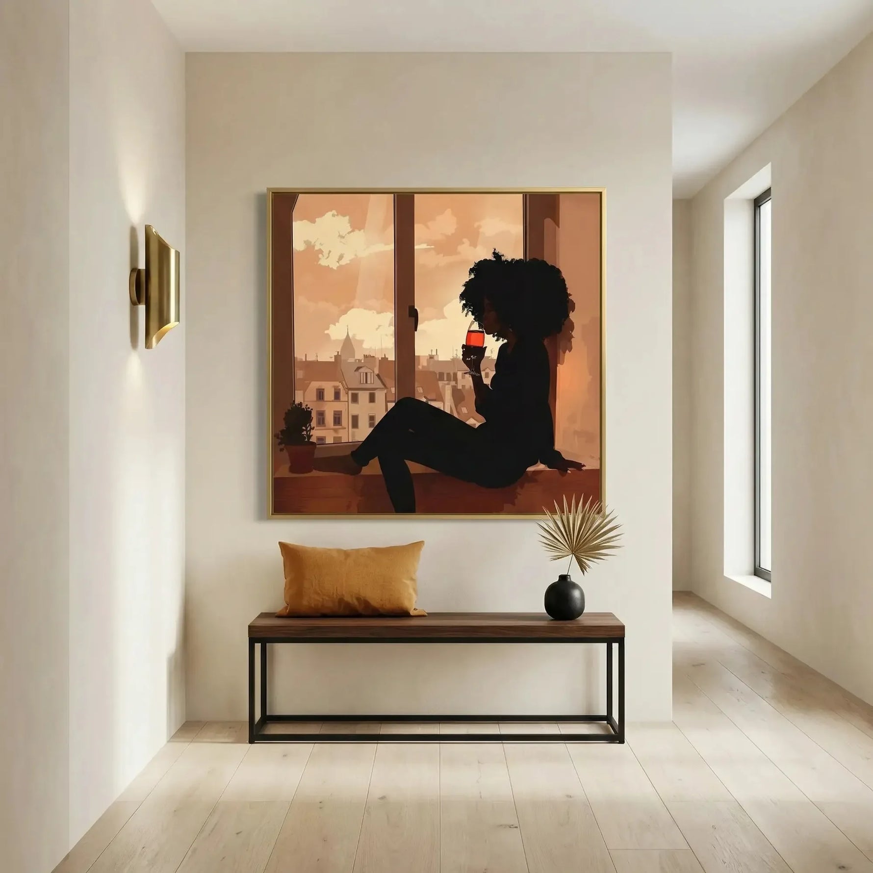 Modern Black art for apartment, gold framed woman and wine print above a bench with mustard pillow and dried palm