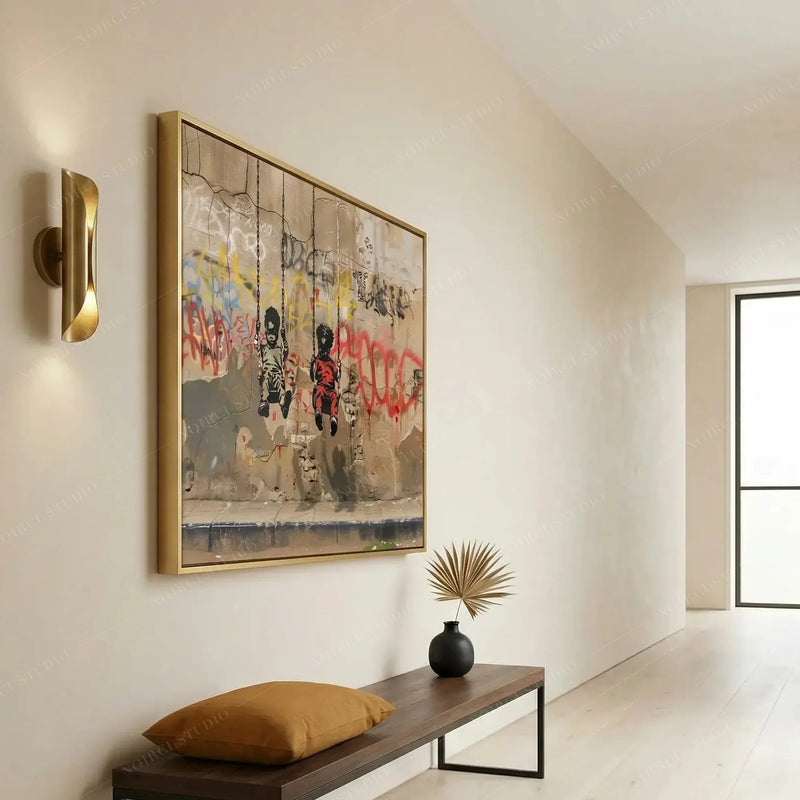 Modern Black art for apartment, gold-framed graffiti piece in a minimalist hallway with a brass sconce and bench