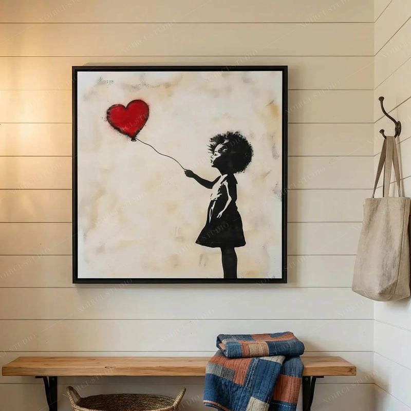 Black girl magic wall art in a shiplap mudroom above a wood bench with a folded patchwork quilt and tote bag