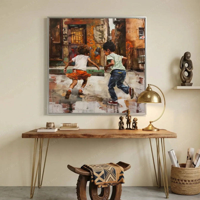 African American art for a home office, silver framed painting over a walnut console with brass lamp and carved figures