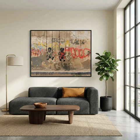 Graffiti canvas of two Black boys on swings above a charcoal sofa and fiddle leaf fig in a minimalist living room