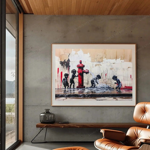 Urban black family artwork of kids playing at a red fire hydrant, framed print on a concrete wall above a leather chair
