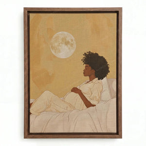 Black motherhood art in a walnut floating frame, expectant mother in cream pajamas gazing up at the moon