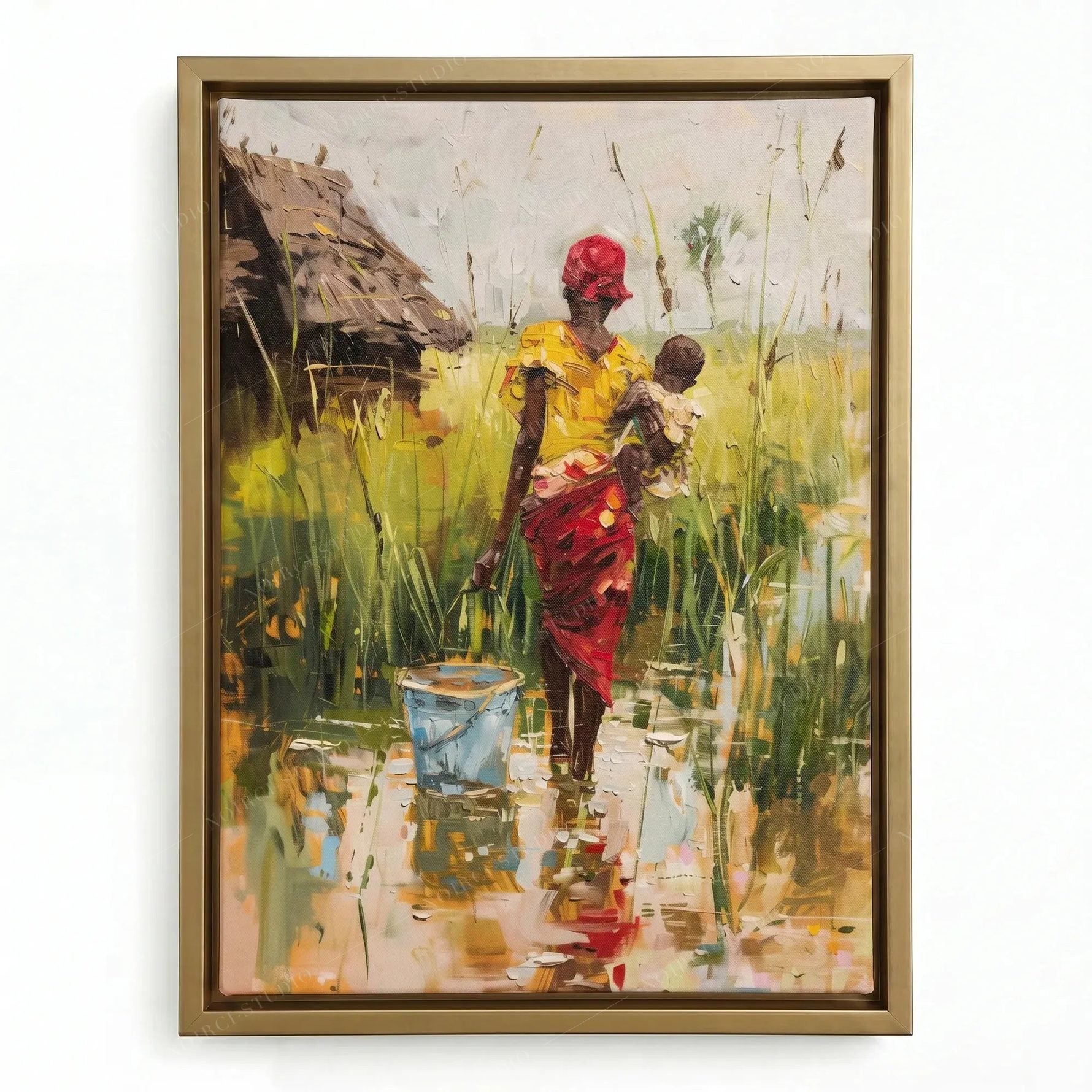 African wall decor in a gold floating frame, woman carrying her child and a blue bucket through the reeds