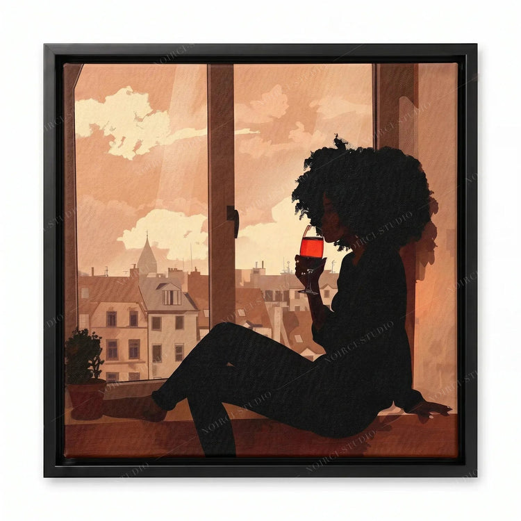 Black wall art in a black floating frame, silhouette of a woman with an afro drinking red wine by a city window