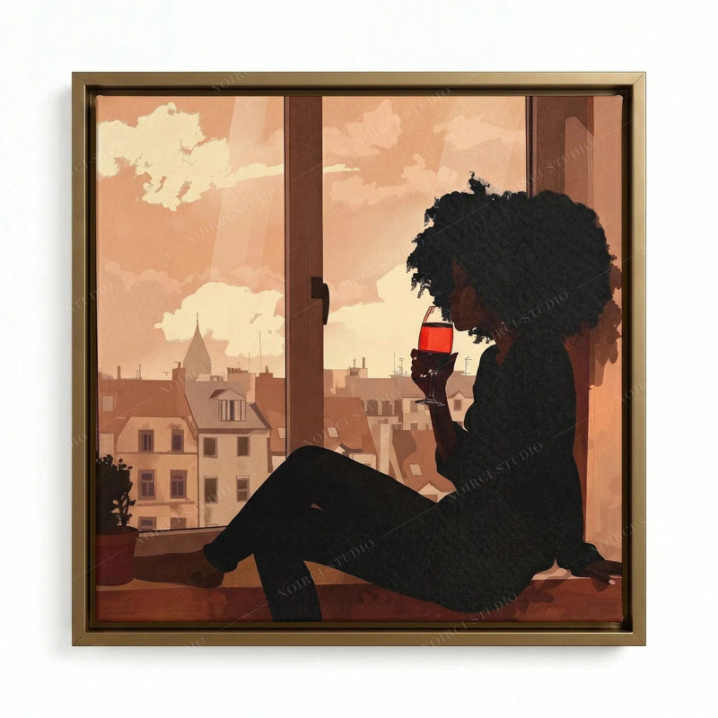 Confident Black woman art in a gold floating frame, seated silhouette sipping wine as evening light fills the window