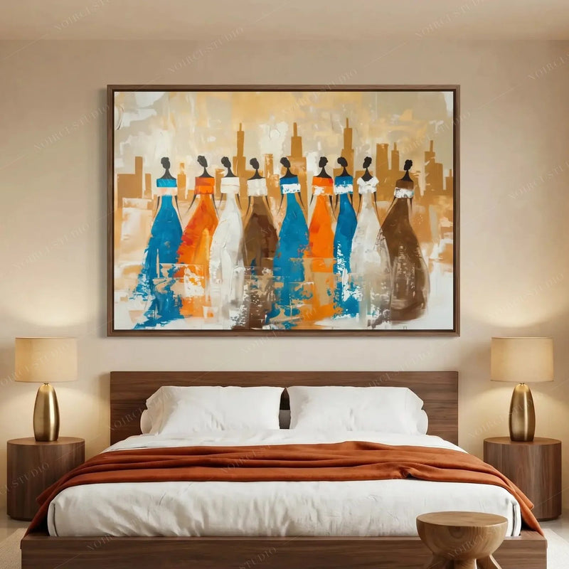 Ancestors African tribal wall art for the bedroom, walnut framed nine tribal women above a platform bed with brass lamps