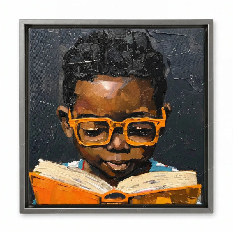 Black children's wall art in a silver floating frame, showing a boy in orange glasses reading against a dark background